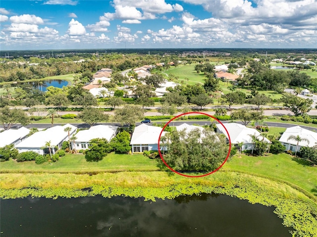 649 Crossfield Cir Unit 10, Venice, FL 34293 - aerial perspective of suburban area with a nearby body of water and a tree filled landscape