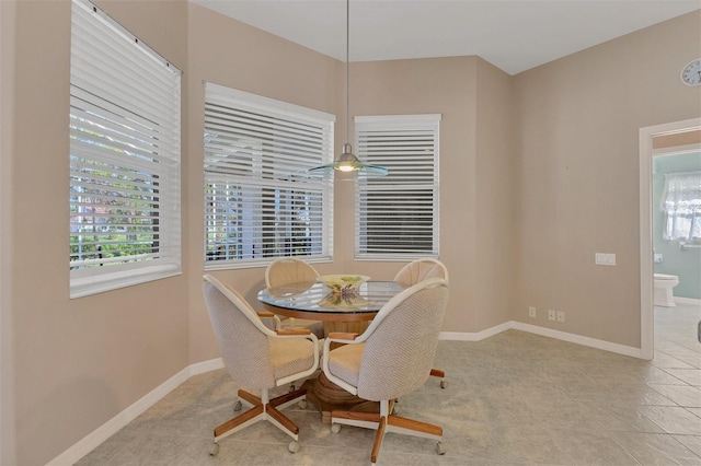 tiled dining room with ceiling fan