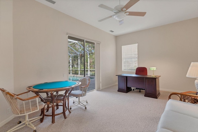 office space with ceiling fan and light colored carpet