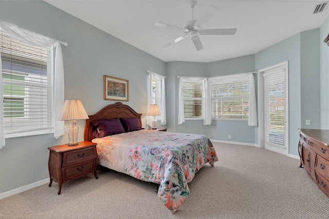 carpeted bedroom featuring ceiling fan and access to outside