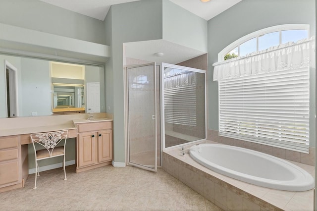 bathroom with vanity, tile patterned floors, and independent shower and bath