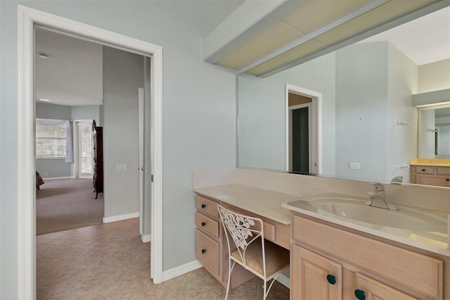 bathroom with tile patterned floors and vanity