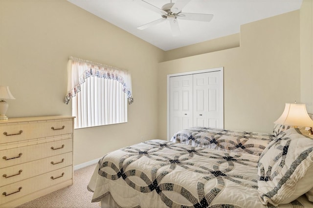 carpeted bedroom featuring ceiling fan and a closet