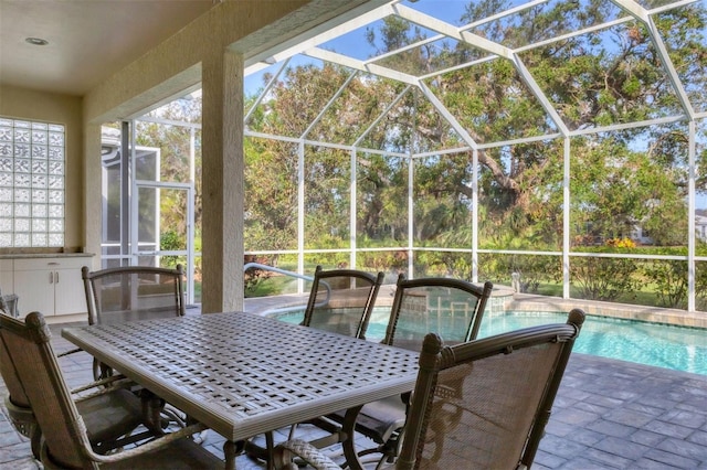 view of patio with glass enclosure