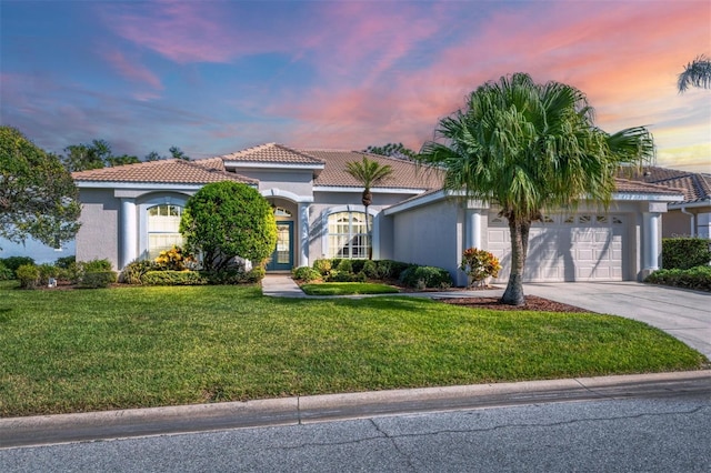 mediterranean / spanish-style house featuring a lawn