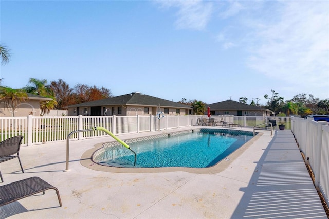 view of swimming pool featuring a patio area