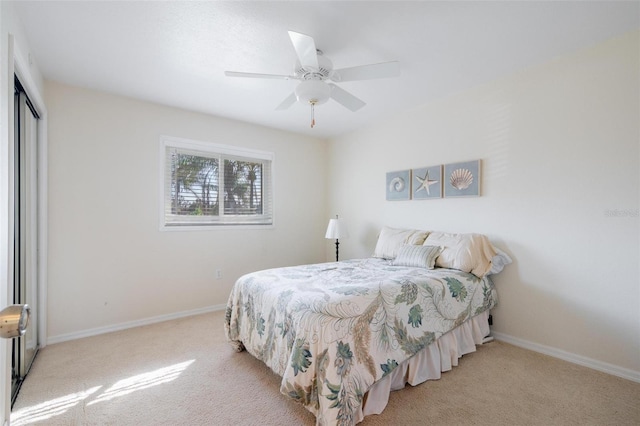 bedroom with light carpet, a closet, and ceiling fan