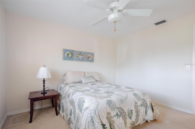 bedroom featuring light carpet and ceiling fan