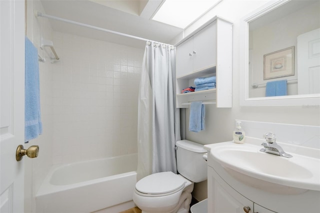 full bathroom featuring vanity, shower / bath combination with curtain, and toilet