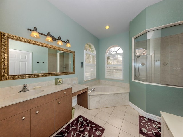 bathroom featuring shower with separate bathtub, vanity, and tile patterned floors