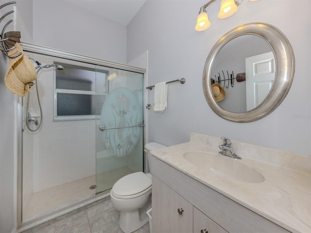 bathroom with tile patterned flooring, vanity, toilet, and a shower with shower door