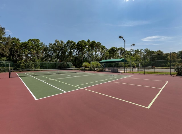 view of sport court featuring basketball hoop