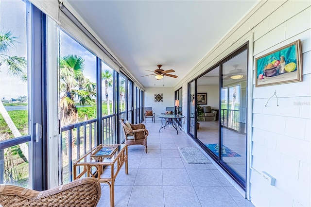 sunroom / solarium with ceiling fan