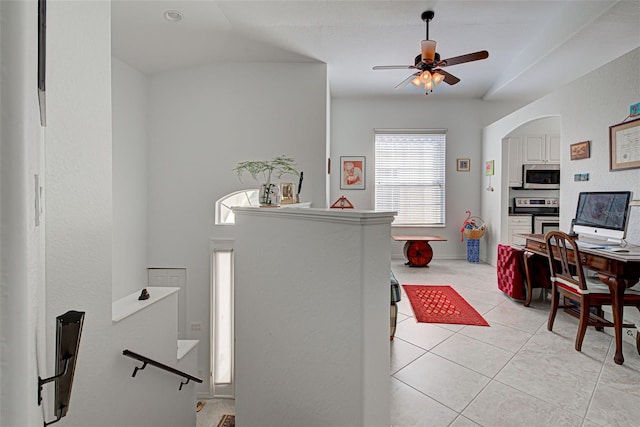 interior space featuring ceiling fan