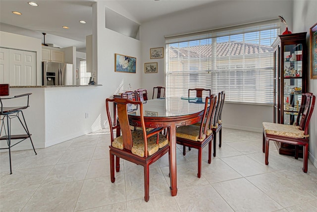 dining area with light tile patterned floors