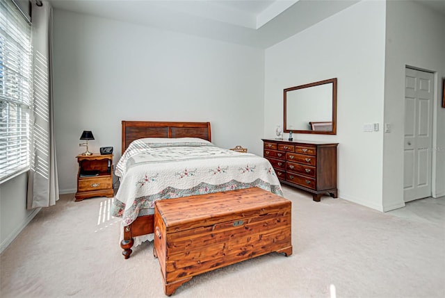 bedroom with light colored carpet