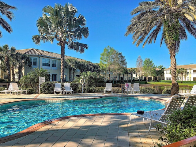 view of swimming pool with a patio area