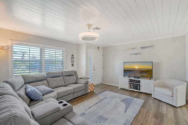 living room with light hardwood / wood-style floors, crown molding, and wooden ceiling