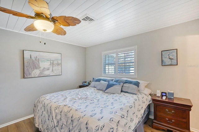 bedroom featuring wood-type flooring and ceiling fan