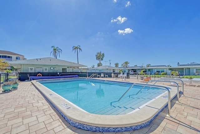 view of swimming pool with a patio