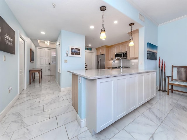 147 Tampa Ave E Unit 202, Venice, FL 34285 - kitchen with appliances with stainless steel finishes, light marble finish flooring, baseboards, recessed lighting, and a peninsula