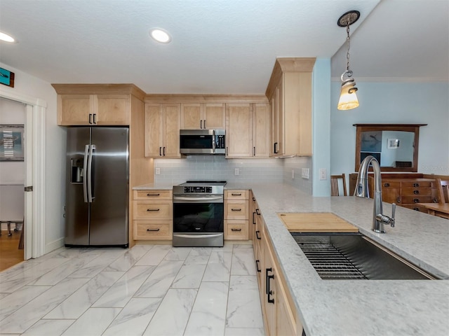 147 Tampa Ave E Unit 202, Venice, FL 34285 - kitchen featuring appliances with stainless steel finishes, a sink, light brown cabinets, light countertops, and recessed lighting