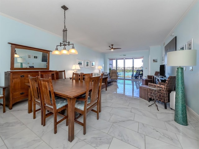 dining room featuring ornamental molding and ceiling fan with notable chandelier