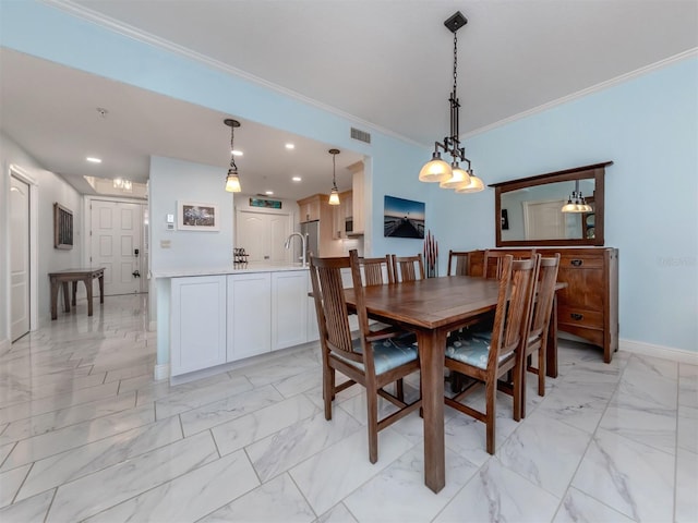 dining space with ornamental molding