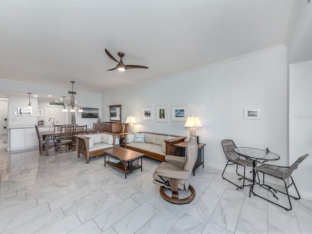 living room with crown molding and ceiling fan with notable chandelier