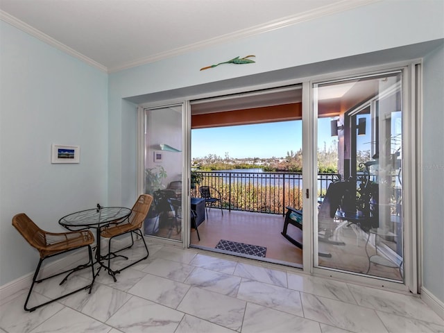 entryway featuring ornamental molding