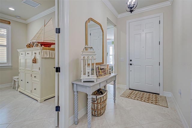 foyer featuring light tile patterned floors and ornamental molding