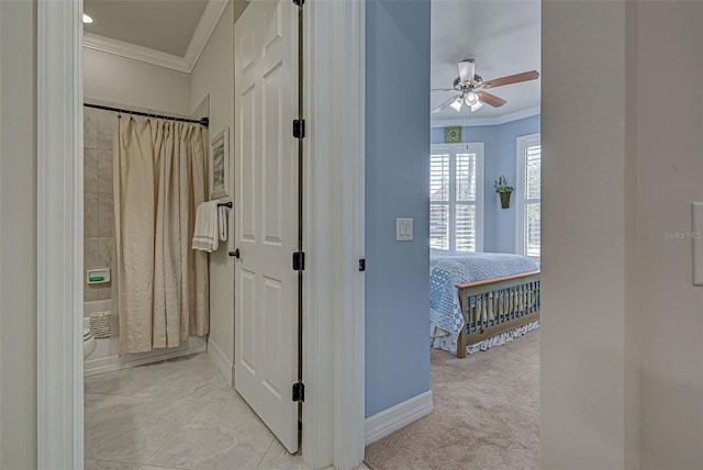 hall with light carpet and ornamental molding