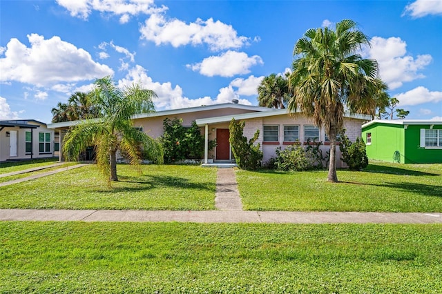 ranch-style house with a front lawn