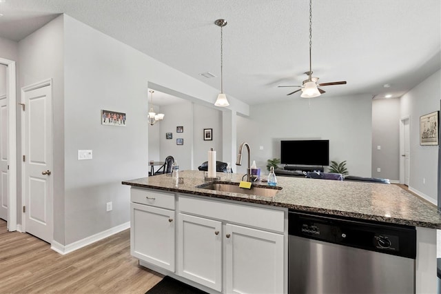 kitchen featuring dishwasher, sink, light hardwood / wood-style flooring, a textured ceiling, and white cabinets