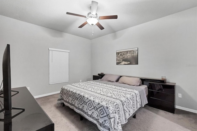 carpeted bedroom featuring a textured ceiling and ceiling fan