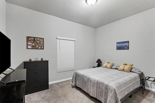 carpeted bedroom with a textured ceiling