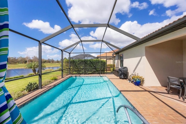 view of swimming pool featuring a patio area, a lanai, grilling area, and a water view