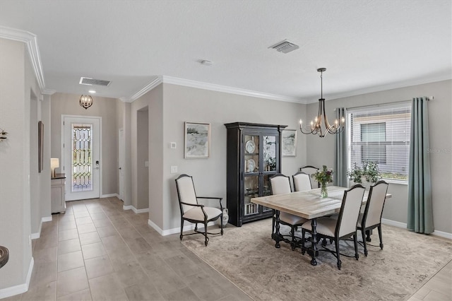 dining room with a textured ceiling, a chandelier, and ornamental molding