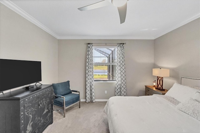 bedroom with light carpet, ceiling fan, and crown molding