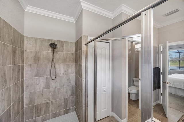 bathroom with walk in shower, tile patterned flooring, and toilet