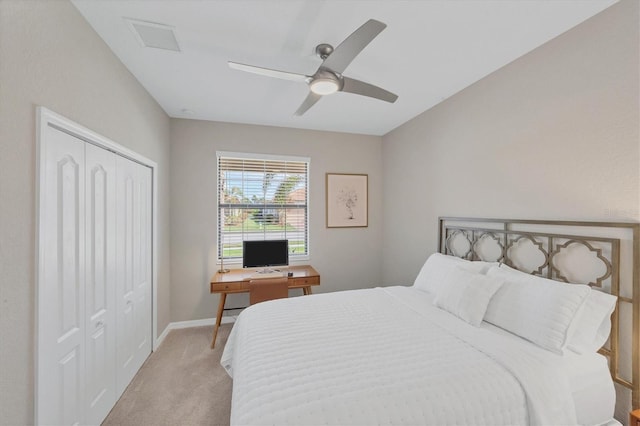 carpeted bedroom featuring a closet and ceiling fan