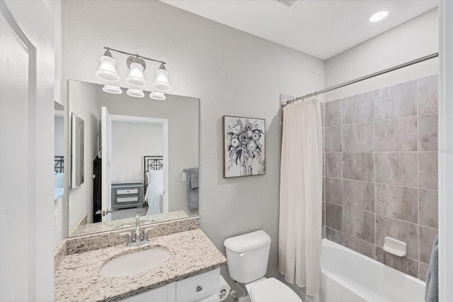 full bathroom with toilet, vanity, and shower / tub combo with curtain