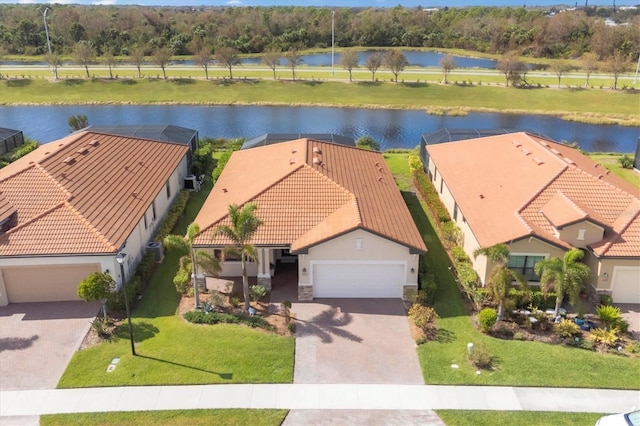 drone / aerial view with a water view