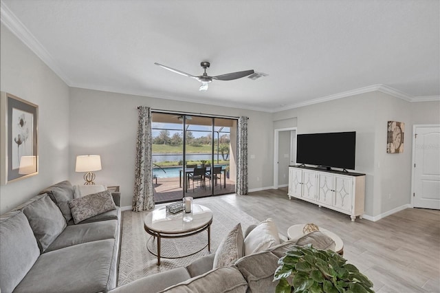 living room with ceiling fan, crown molding, and light hardwood / wood-style floors