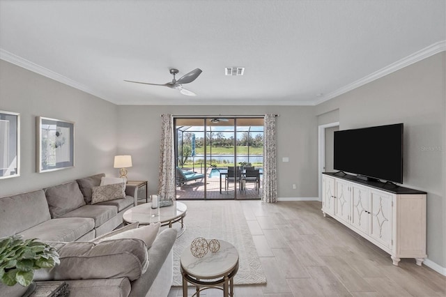 living room featuring ceiling fan, crown molding, and light hardwood / wood-style floors