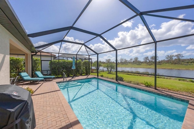 view of swimming pool featuring area for grilling, a lanai, a water view, and a patio area