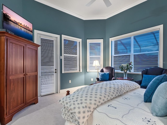 bedroom with ornamental molding, light carpet, ceiling fan, and baseboards