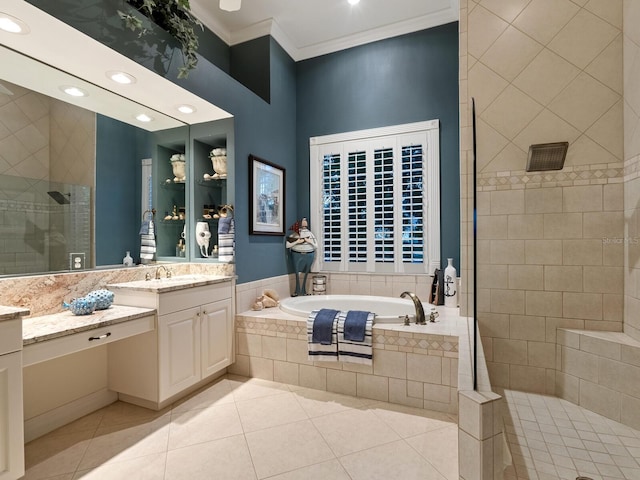 full bathroom featuring a garden tub, tile patterned floors, ornamental molding, vanity, and walk in shower