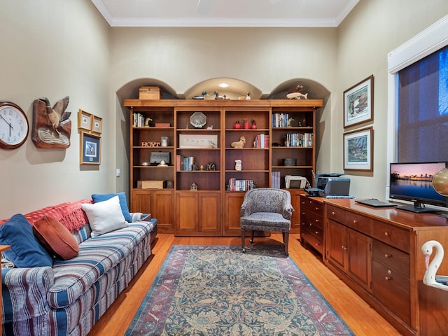 office area featuring ornamental molding and light hardwood / wood-style floors