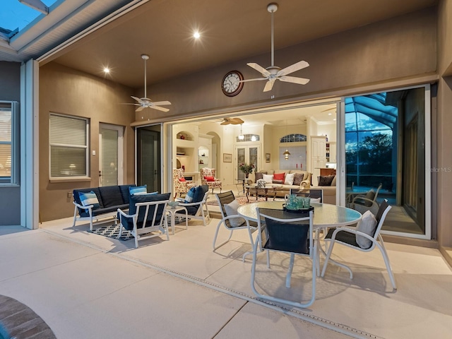 view of patio / terrace with ceiling fan and an outdoor living space